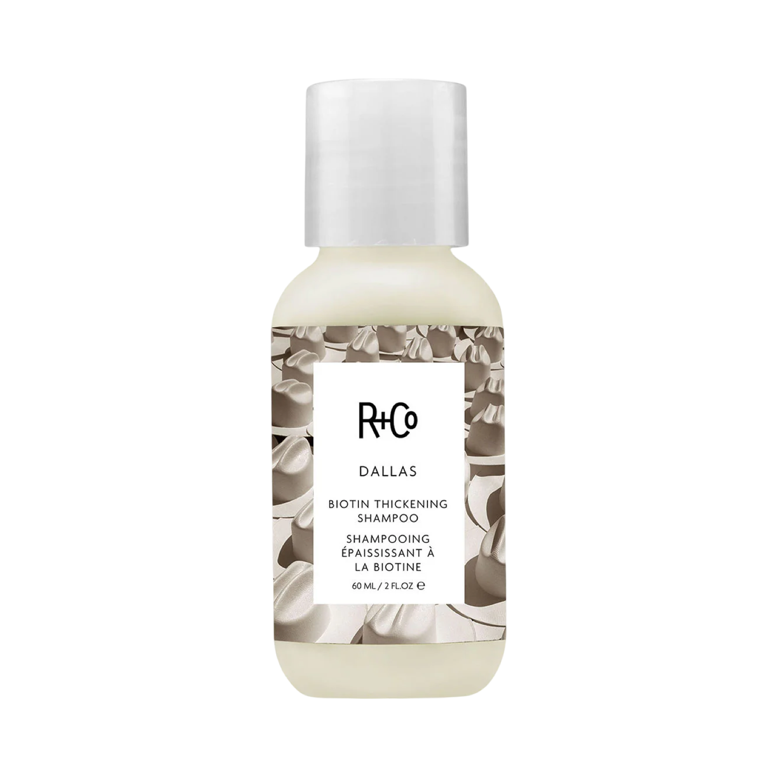 R+Co Dallas Biotin Thickening Shampoo bottle on a white background