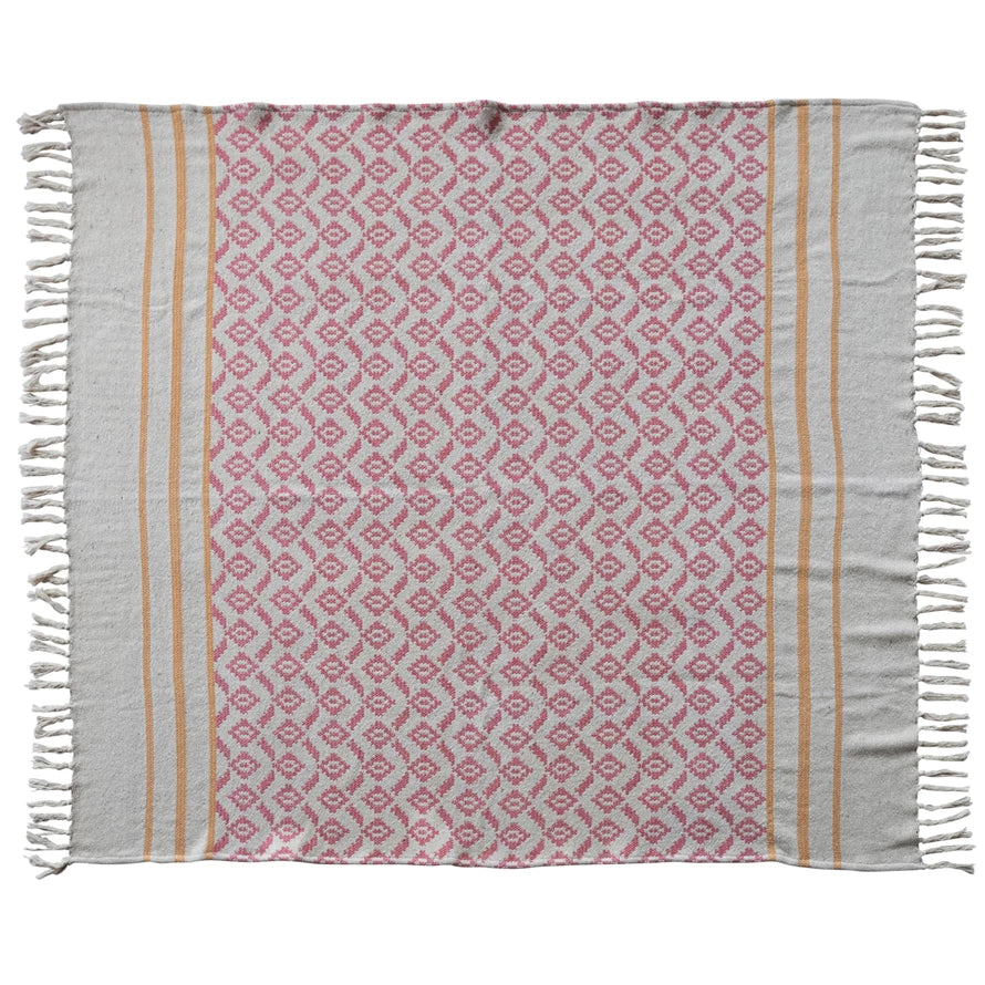 Patterned towel with pink and beige design on a white background