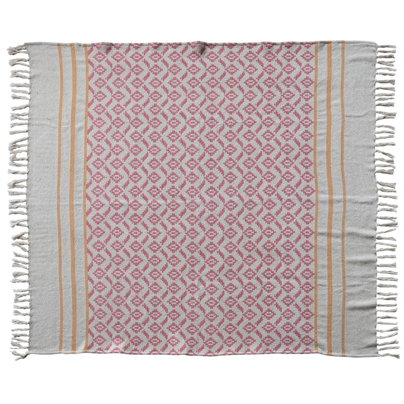 Patterned towel with pink and beige design on a white background