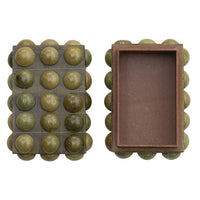 Green bead container with a brown interior on a white background