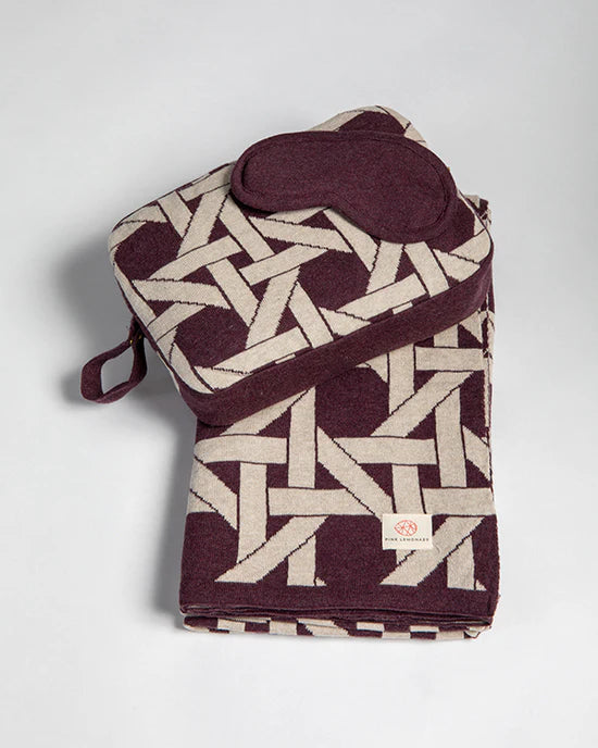riti travel blanket, burgundy travel blanket set, organic cotton blanket and eye mask, eco friendly travel accessories, sustainable travel blanket, cozy blanket for flights, organic cotton sleep mask, burgundy travel essentials