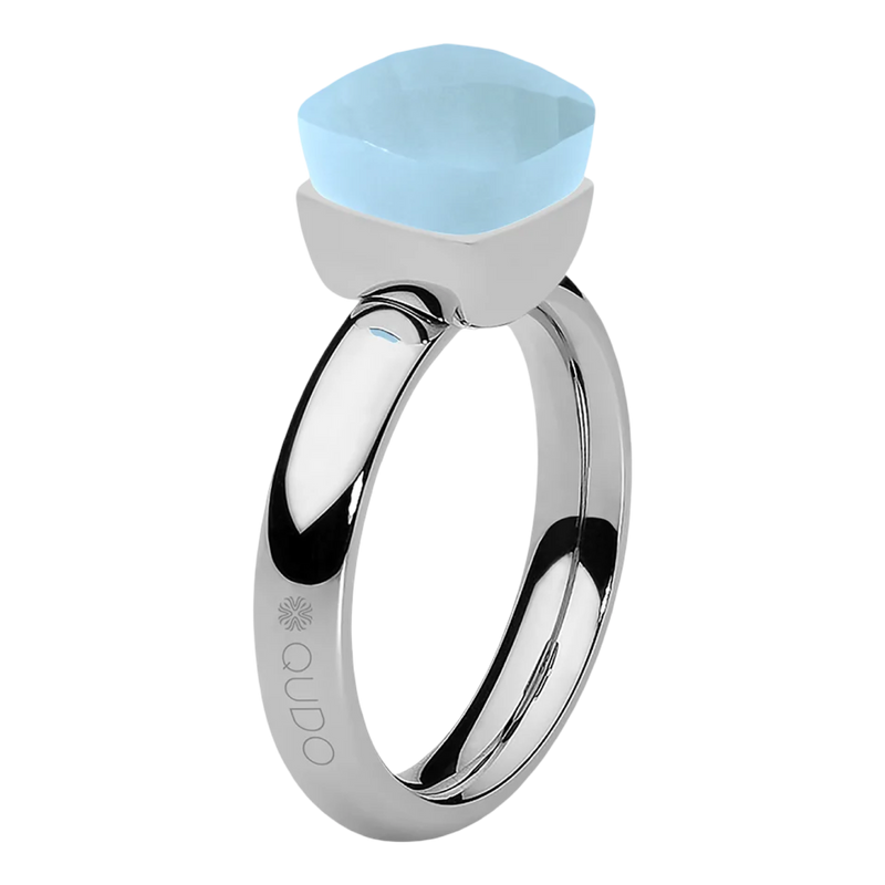 Silver ring with a light blue gemstone on a white background