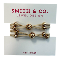 Set of hair ties with gold beads on a 'Smith & Co. Jewel Design' card.