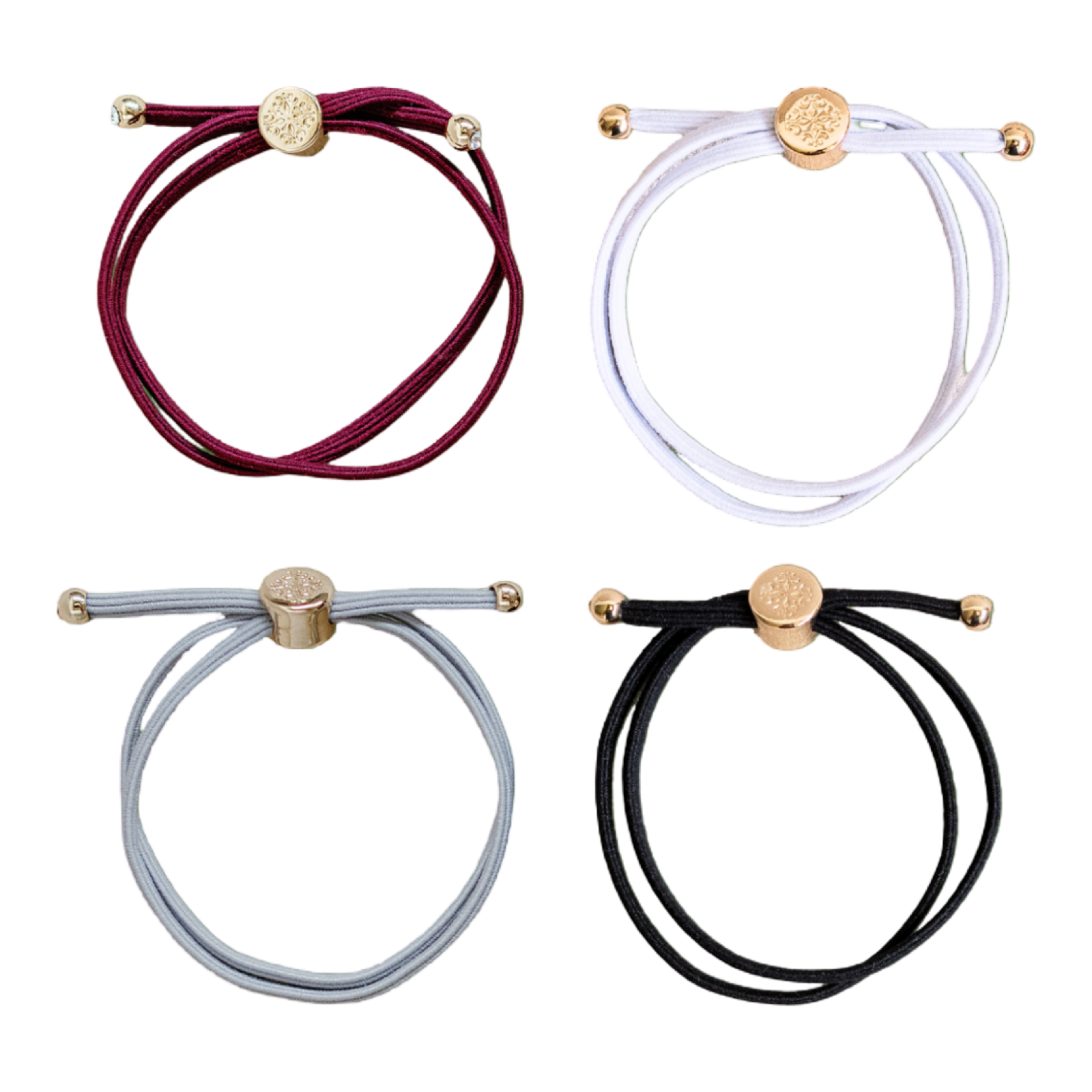 Four bracelets in red, white, gray, and black with gold accents on a white background