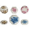 Set of six decorative plates with floral patterns on a white background