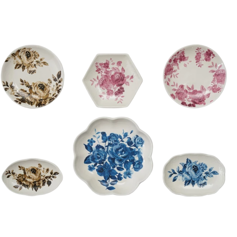 Set of six decorative plates with floral patterns on a white background
