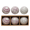 Set of six striped balls in a wooden box on a white background