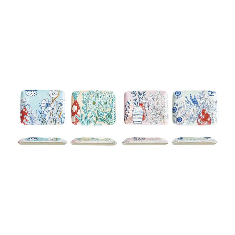 Set of six decorative coasters with floral and nature-themed designs on a white background