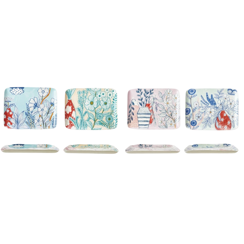 Set of decorative plates with floral and nature-themed designs on a white background