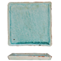 Turquoise square tile with a matching rectangular base on a white background