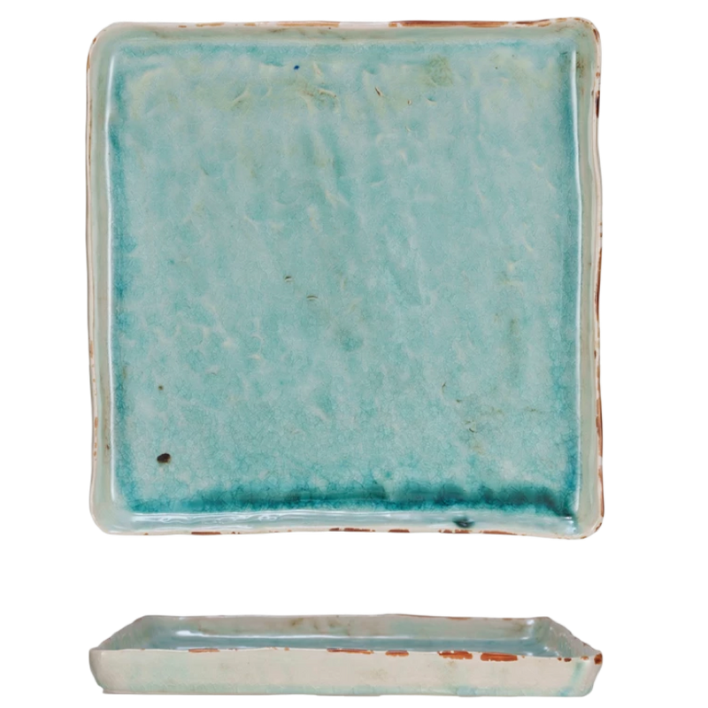 Turquoise square tile with a matching rectangular base on a white background
