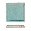 Rectangular ceramic dish with a textured turquoise glaze on a white background