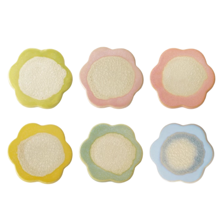 Set of five colorful flower-shaped cookies on a white background
