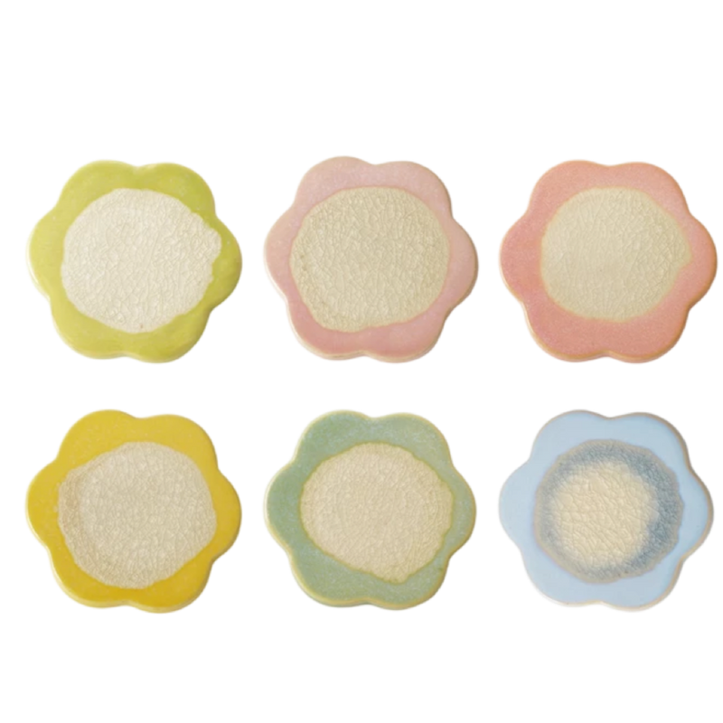 Set of five colorful flower-shaped cookies on a white background