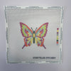 Cross-stitch pattern with a colorful butterfly design on a white background, branded 'Storyteller Stitchery'.