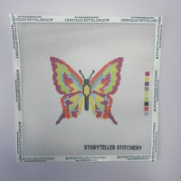 Cross-stitch pattern with a colorful butterfly design on a white background, branded 'Storyteller Stitchery'.