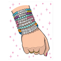 Hand wearing multiple colorful bracelets with text on a white background with pink stars