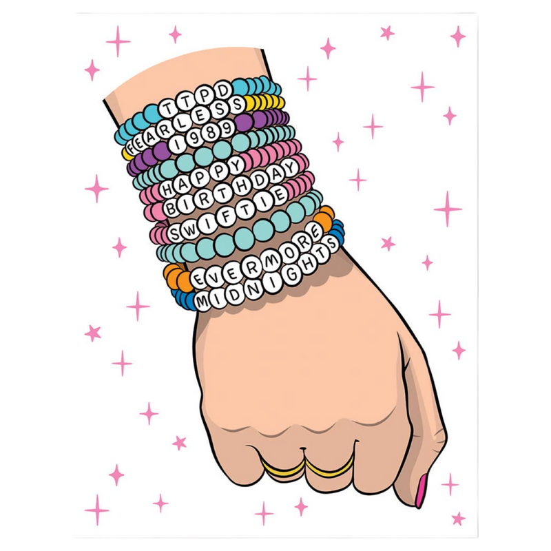 Hand wearing multiple colorful bracelets with text on a white background with pink stars
