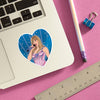 Heart-shaped sticker of a singer on a laptop with a pencil and ruler on a pink background