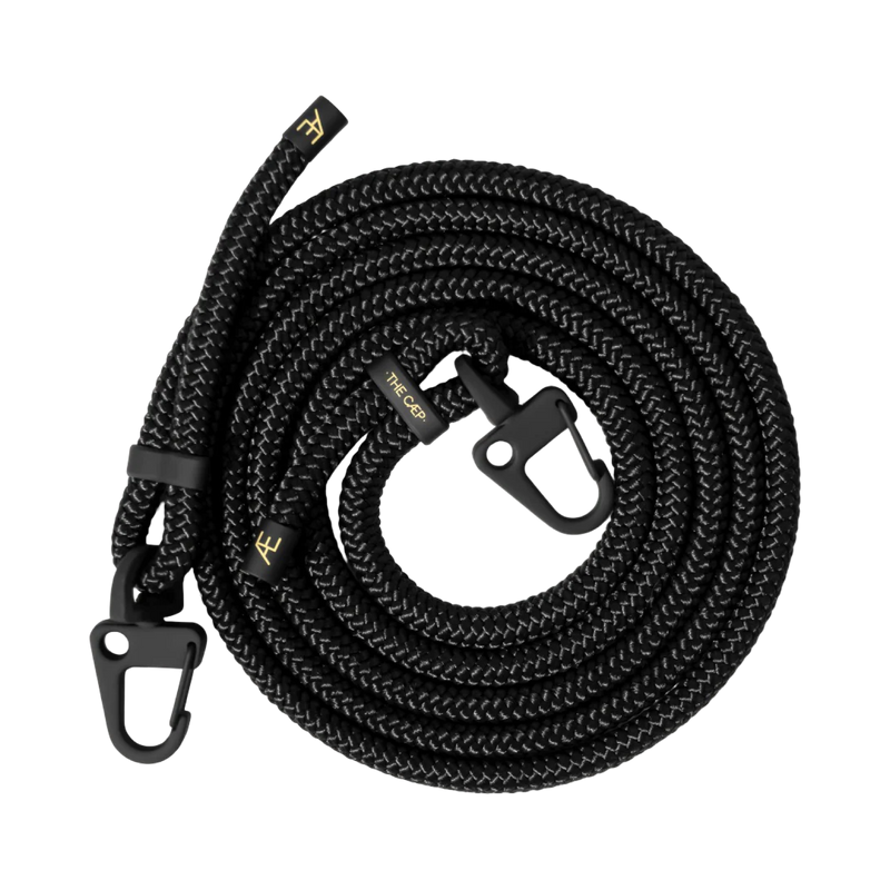 Black braided rope leash with carabiners on a white background