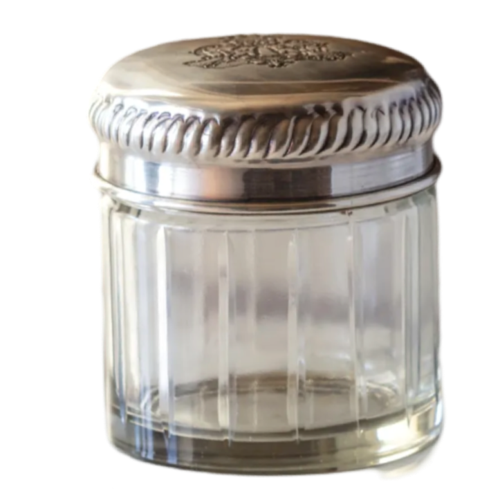 etched silver lid antique tobacco jar by porch view