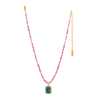 Necklace with pink beads and a colorful pendant on a white background