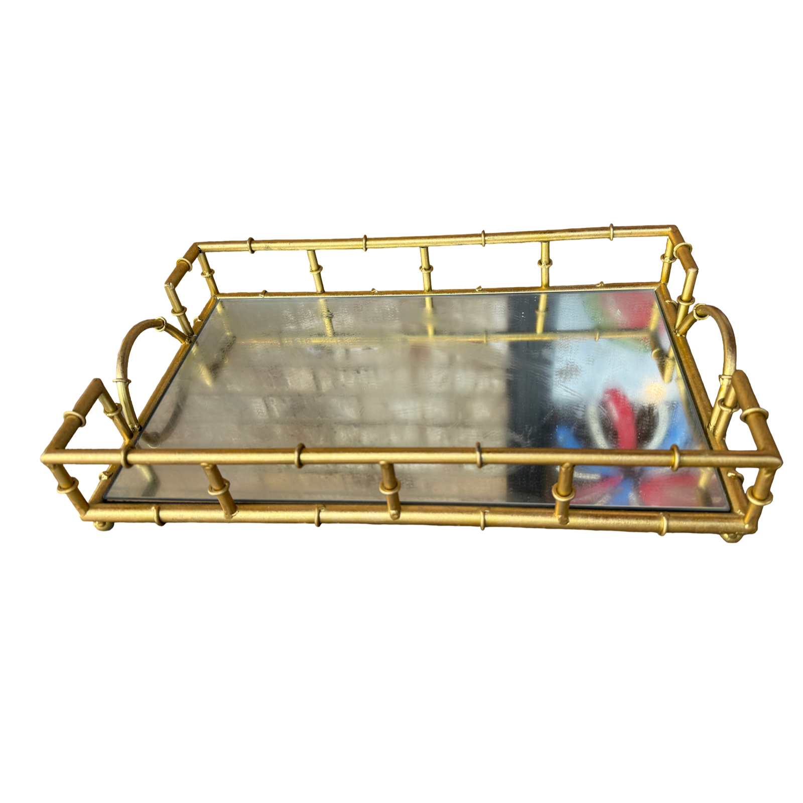 A rectangular serving tray with a gold-toned metal frame designed to look like bamboo stalks, featuring a clear glass tray insert and loop handles on the sides, shown against a plain white background.
