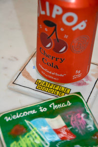 Can of LiPop Cherry Cola on a coaster with 'Waffle House' branding