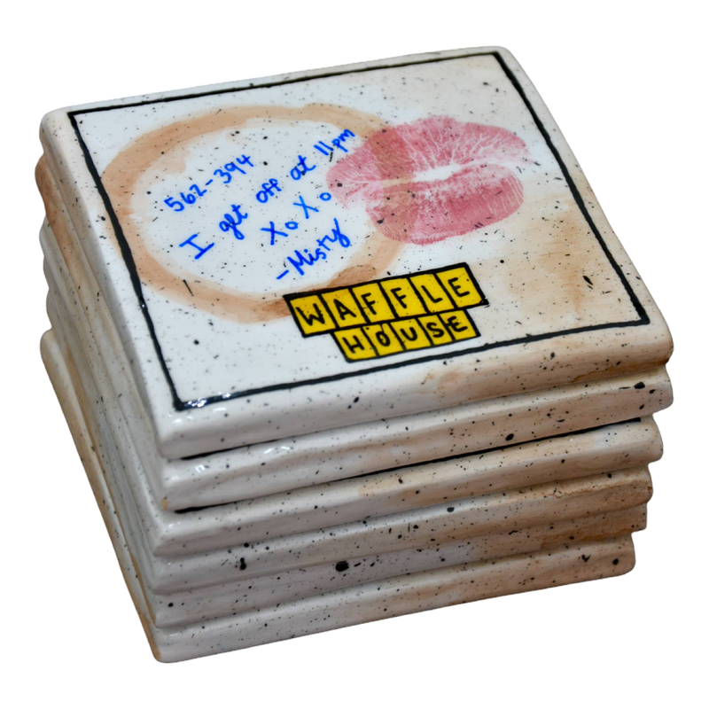 Stack of Waffle House coasters with a signature and phone number on a white background