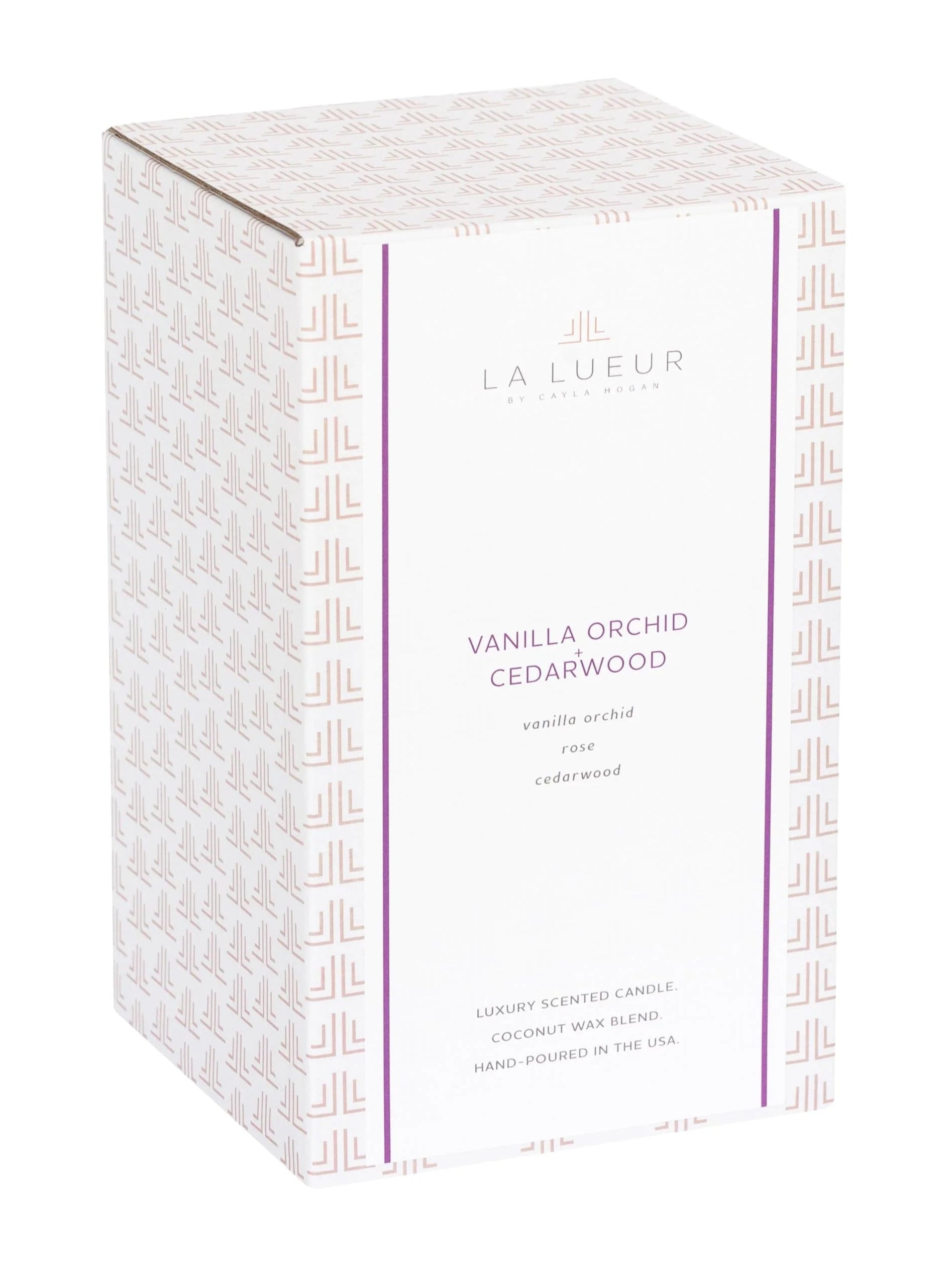 vanilla orchid cedarwood candle, floral woodsy candle, 2-wick luxury candle, purple glass candle with lid, amber musk candle scent, elegant lidded candle, cedar and vanilla home fragrance, reusable glass candle jar, warm floral scented candle, orchid musk balsam candle