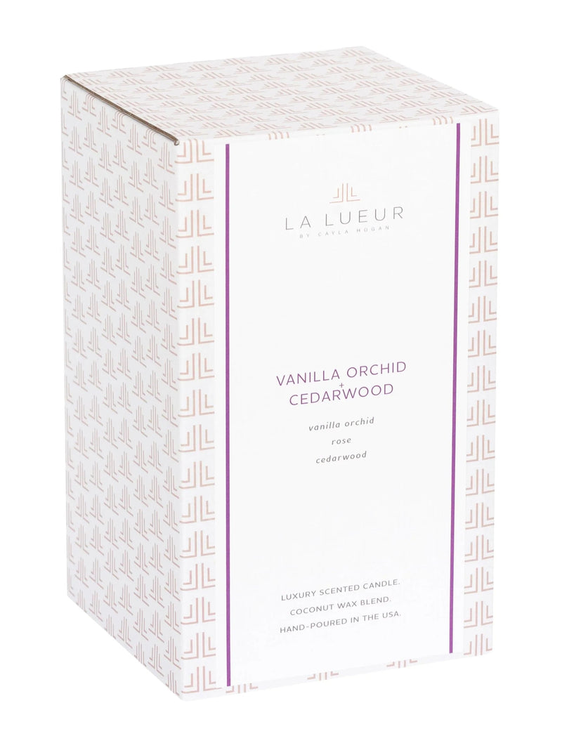 vanilla orchid cedarwood candle, floral woodsy candle, 2-wick luxury candle, purple glass candle with lid, amber musk candle scent, elegant lidded candle, cedar and vanilla home fragrance, reusable glass candle jar, warm floral scented candle, orchid musk balsam candle