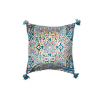 Decorative pillow with intricate pattern and tassels on a white background