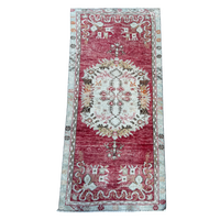 Decorative rug with intricate patterns on a white background