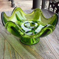 Green glass door handle on a wooden door