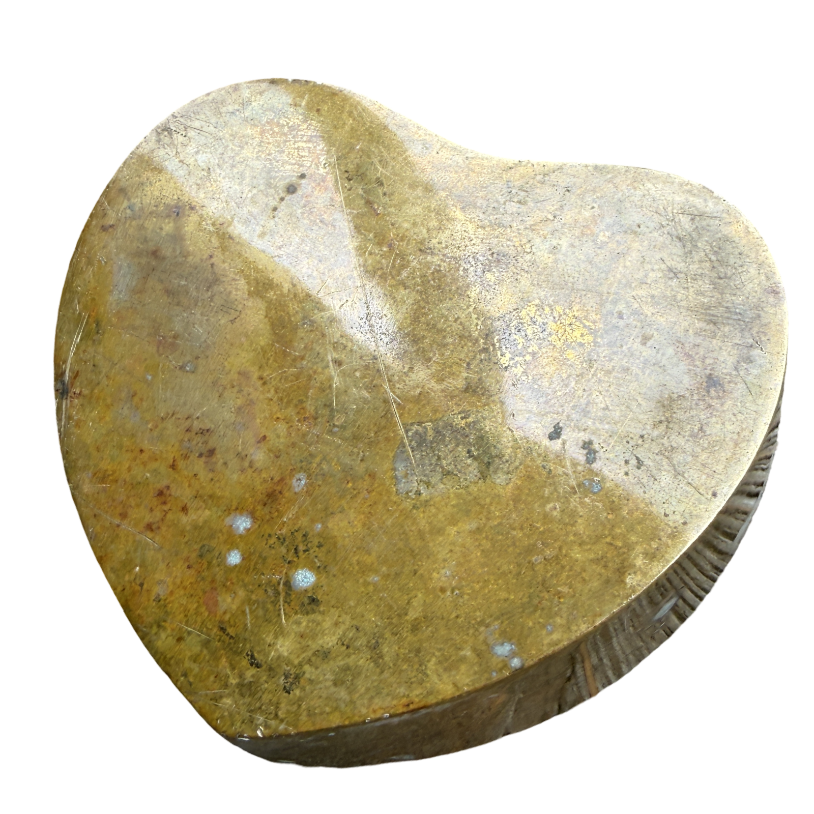 Heart-shaped stone with a rough texture on a white background