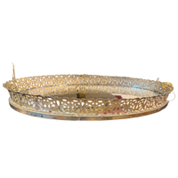 Decorative gold metal tray on a white background