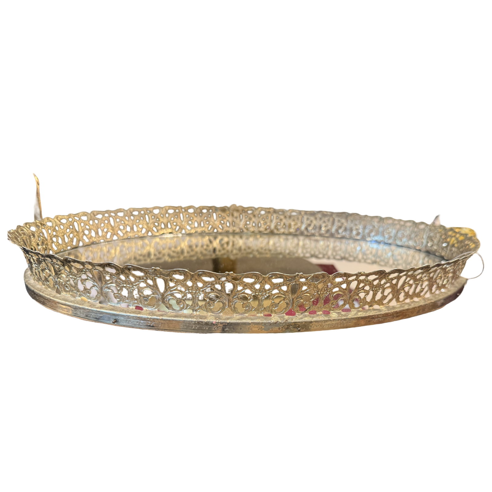 Decorative gold metal tray on a white background