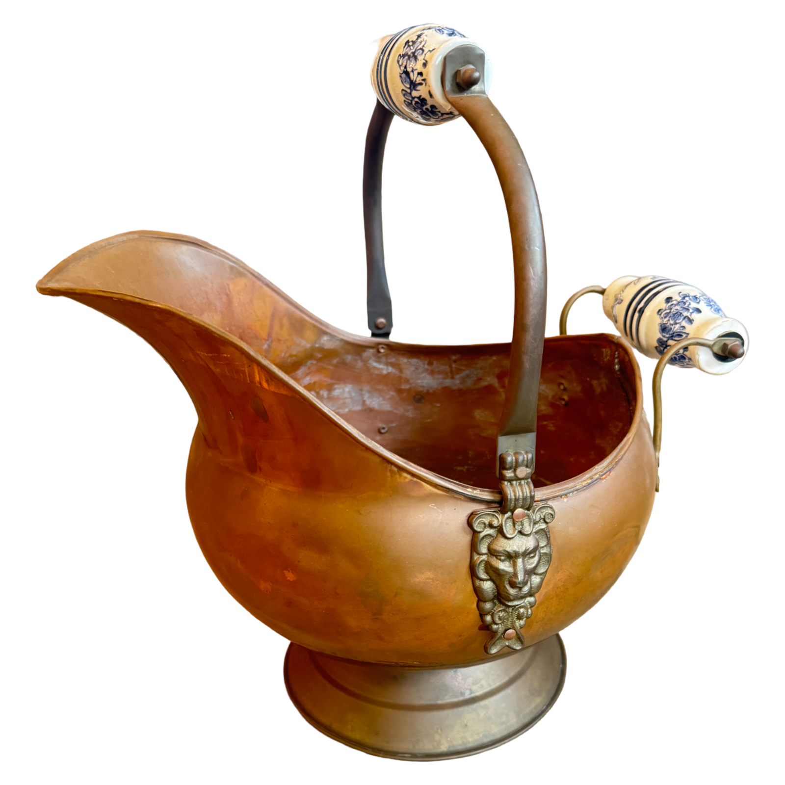 Bronze pitcher with decorative handles on a white background