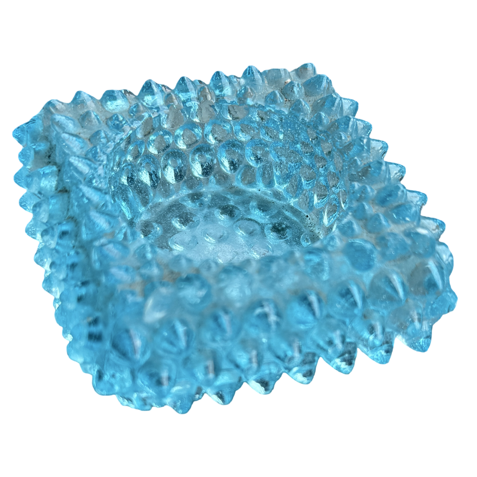 Blue textured ball on a white background