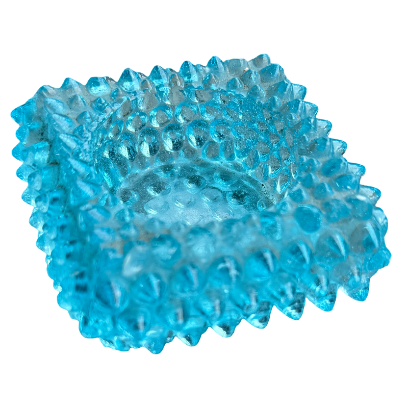 Blue textured ball on a white background