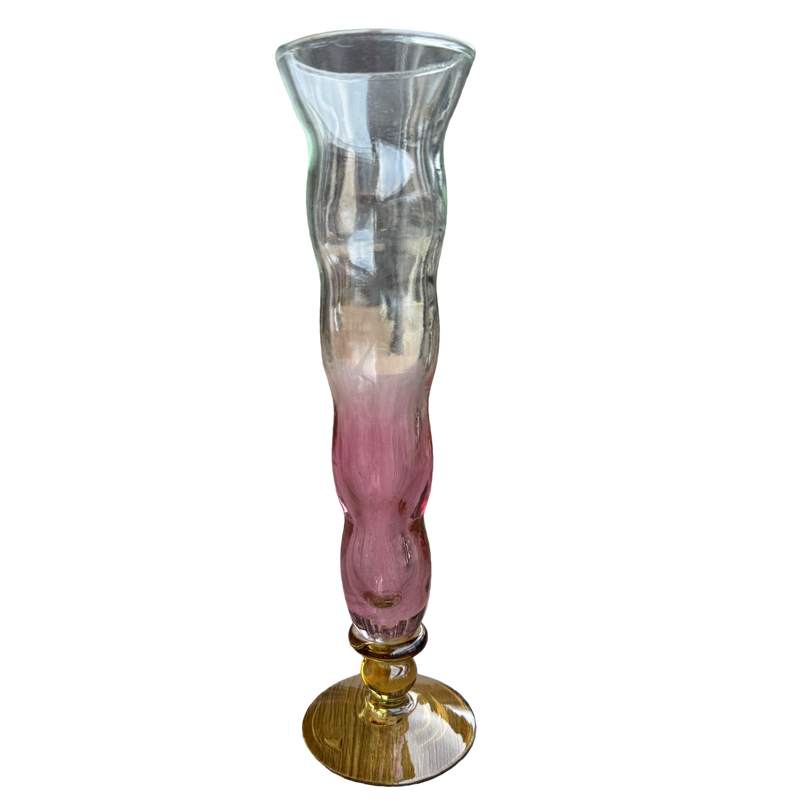 Glass vase with pink and gold base on a white background