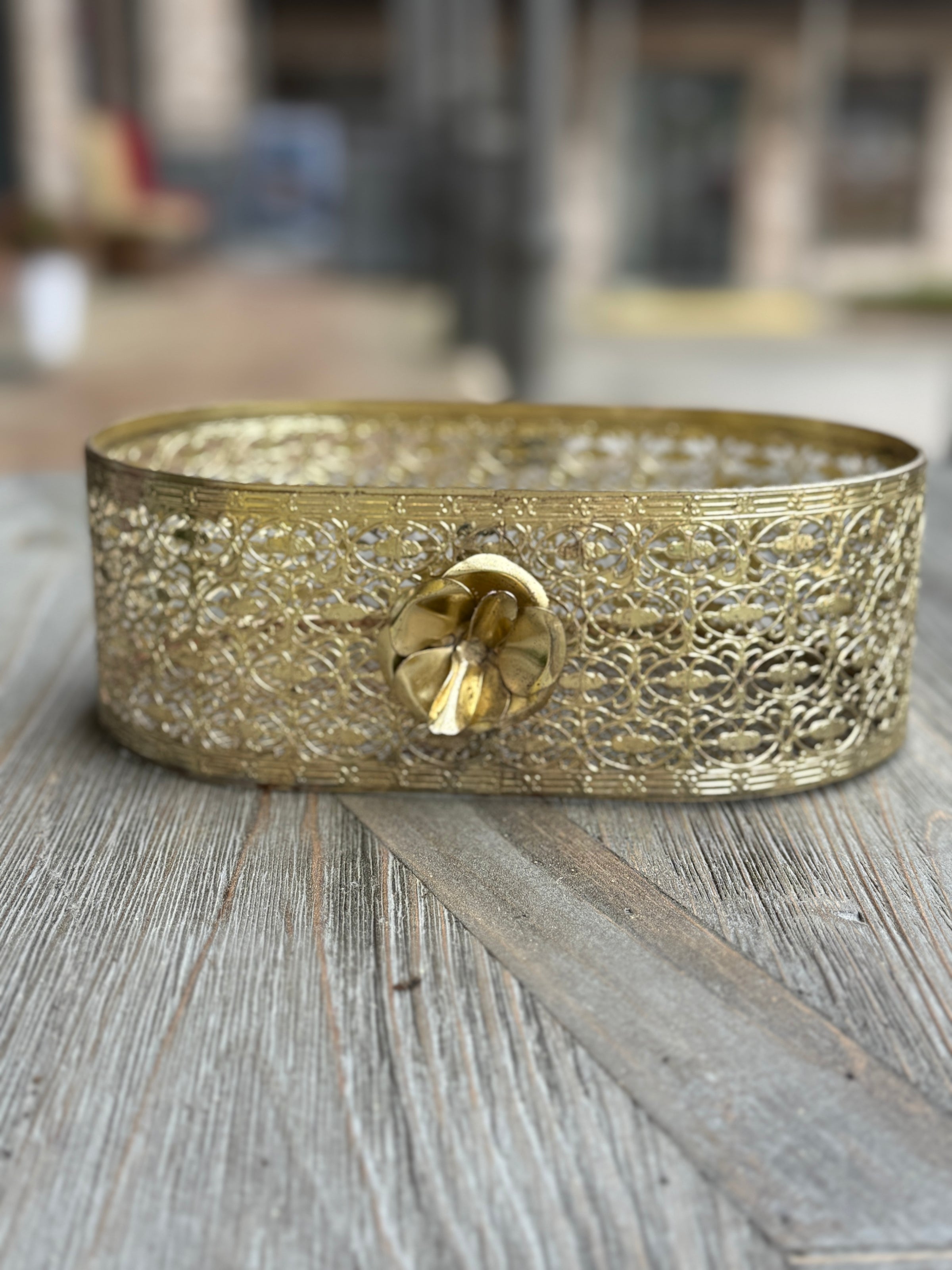 Decorative gold bracelet on a wooden surface