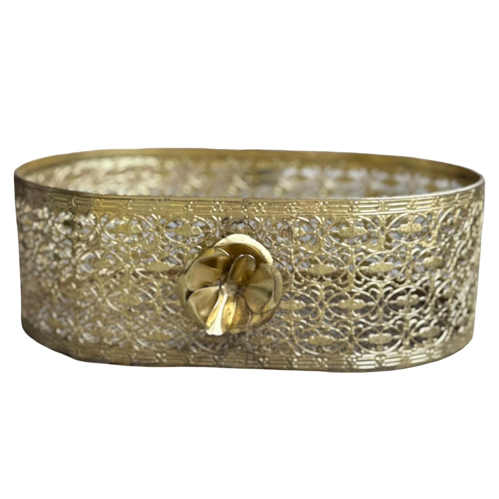 Decorative brass tray with intricate patterns on a white background