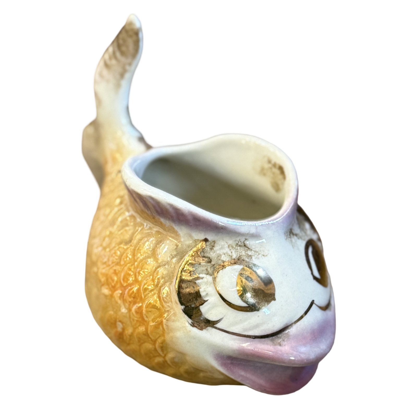 Ceramic fish-shaped vase with a smiling face on a white background