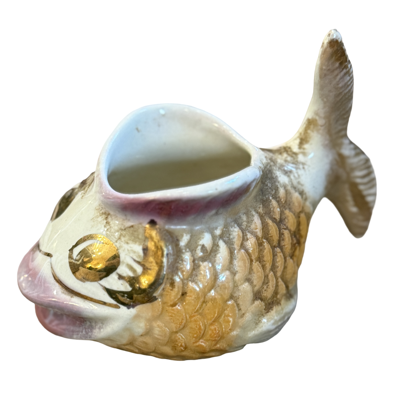 Fish-shaped ceramic container on a white background