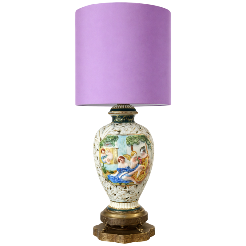 Decorative lamp with a purple shade on a white background