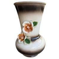 Decorative vase with floral designs on a white background