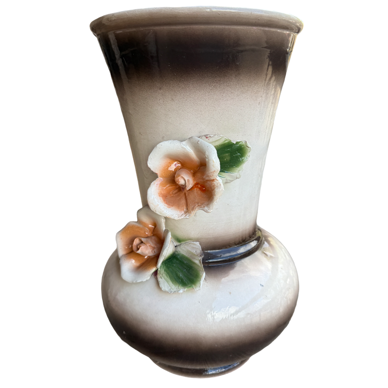 Decorative vase with floral designs on a white background