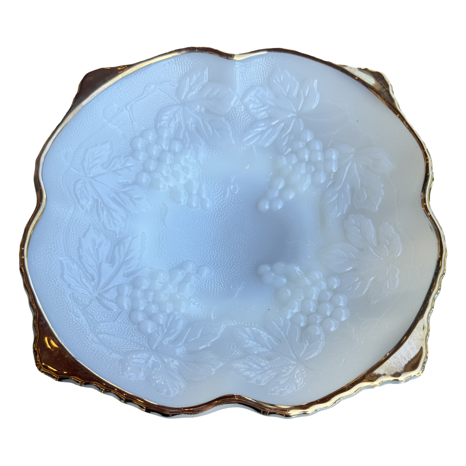 Decorative white bowl with floral patterns and gold rim on a white background