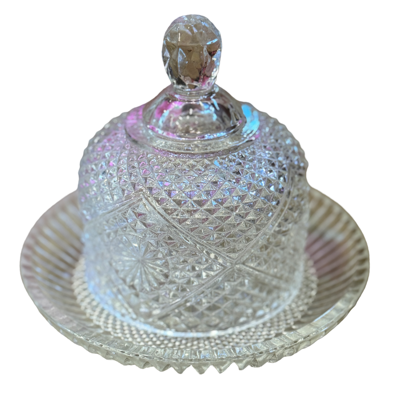 Decorative crystal cheese dish with lid on a white background